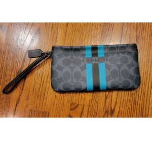 Black, gray, and teal Coach wristlet